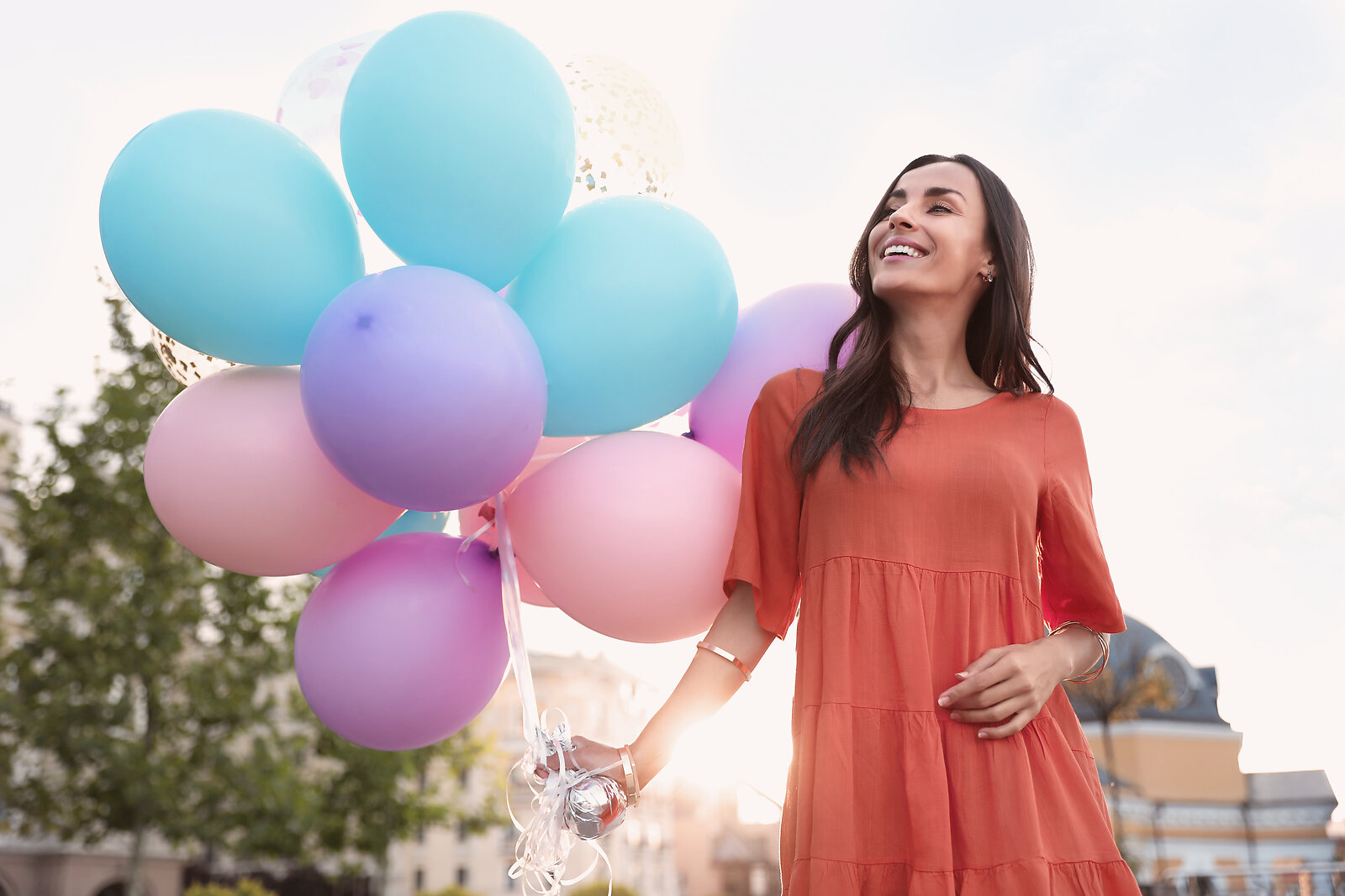 Joyful young woman outdoors representing growth and learning