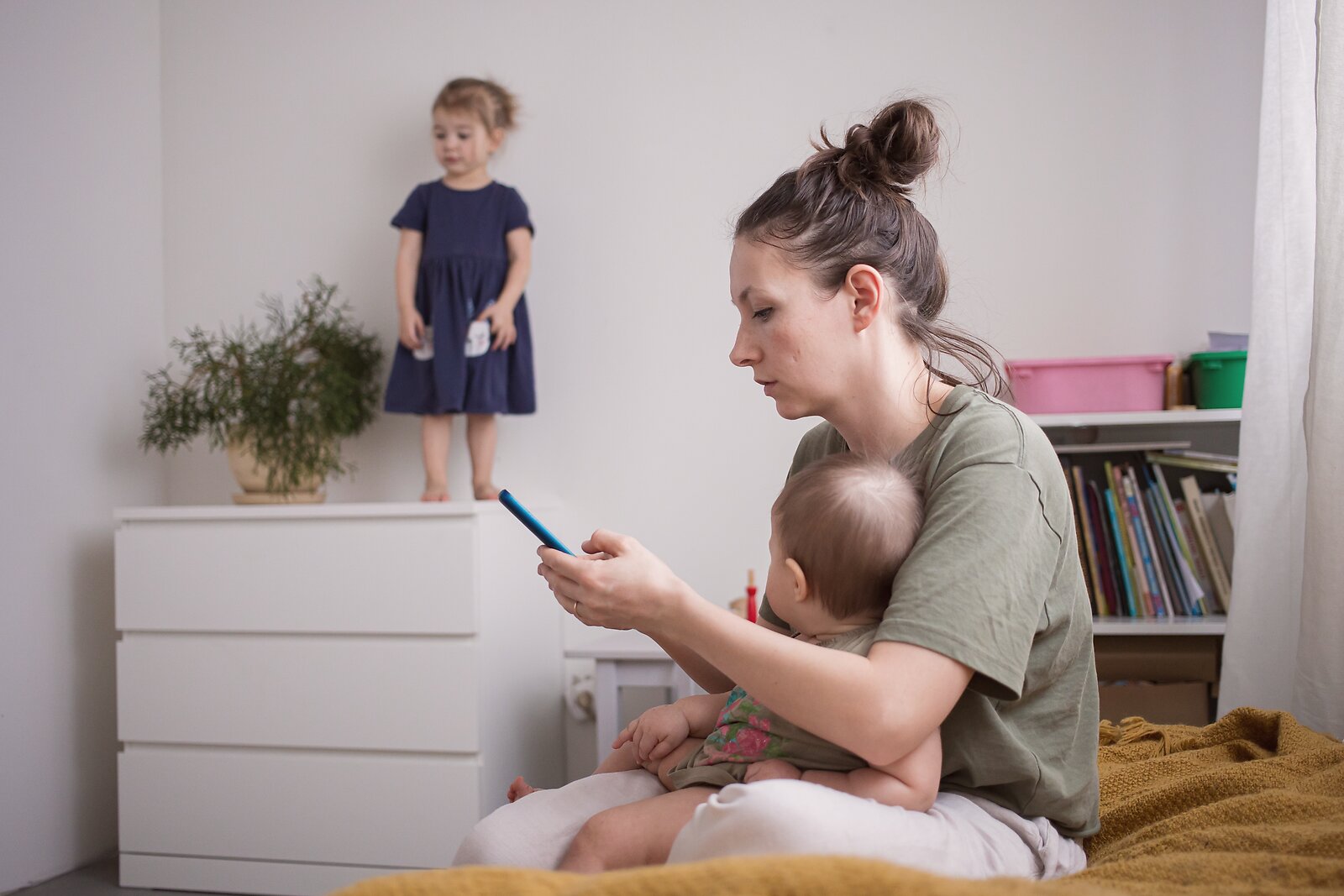 Mother in nursery experiencing intrusive thoughts associated with postpartum OCD